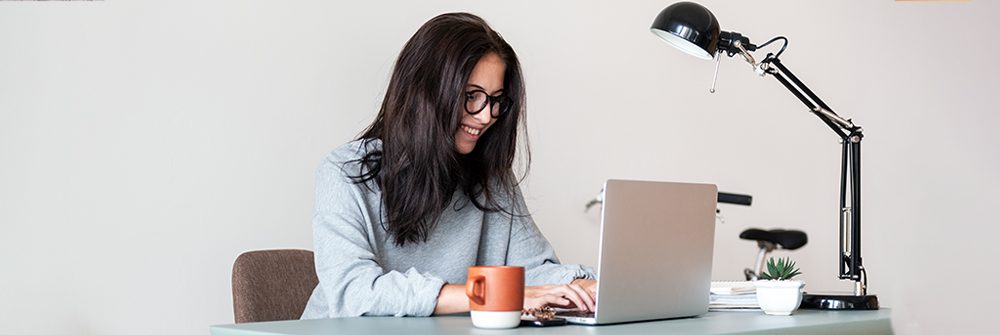 A woman looking at a computer screen