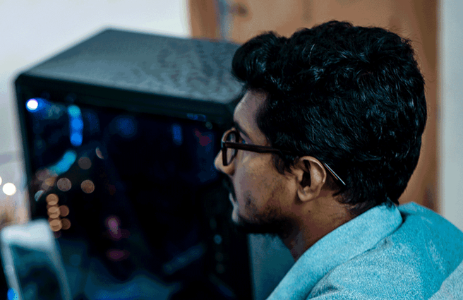 A man looking at a computer screen