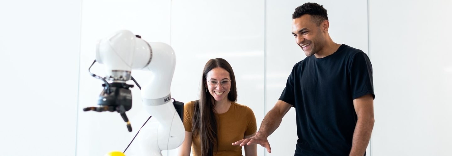 People testing a robotic hand