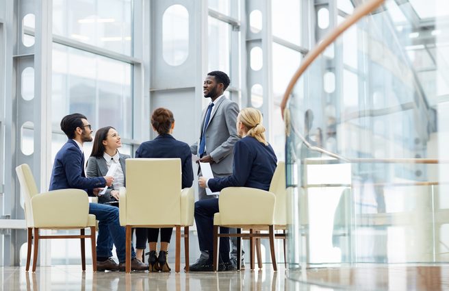 People wearing business suits having a discussion