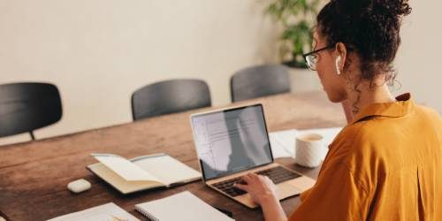 A person looking at a laptop