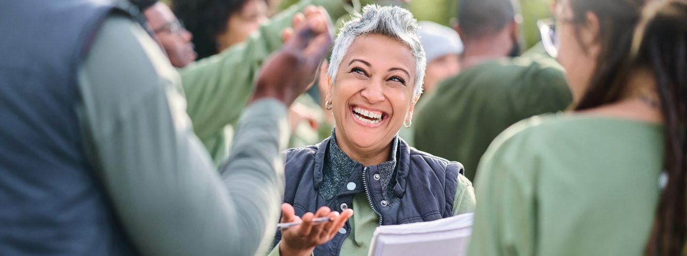 A person smiling in a group